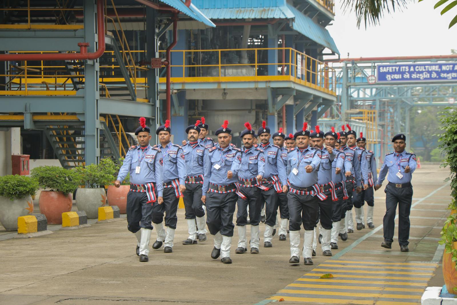 Security guards on perimeter march at an Indian industrial facility